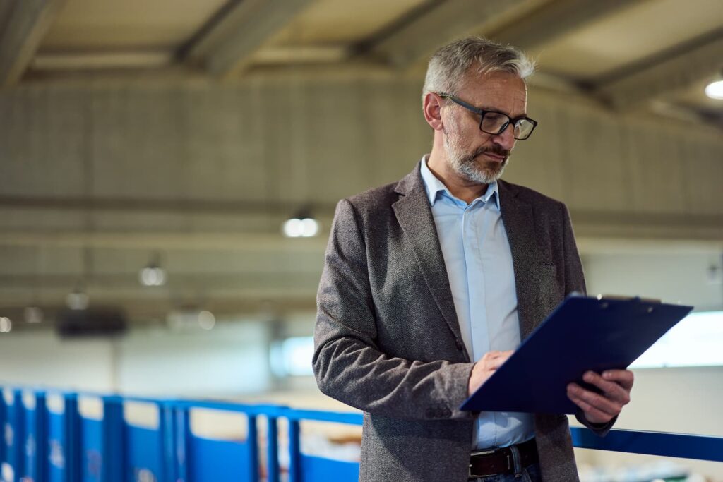procurement-manager-reviewing-manufacturing-contract-factory