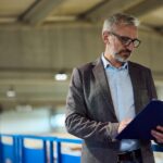 procurement-manager-reviewing-manufacturing-contract-factory